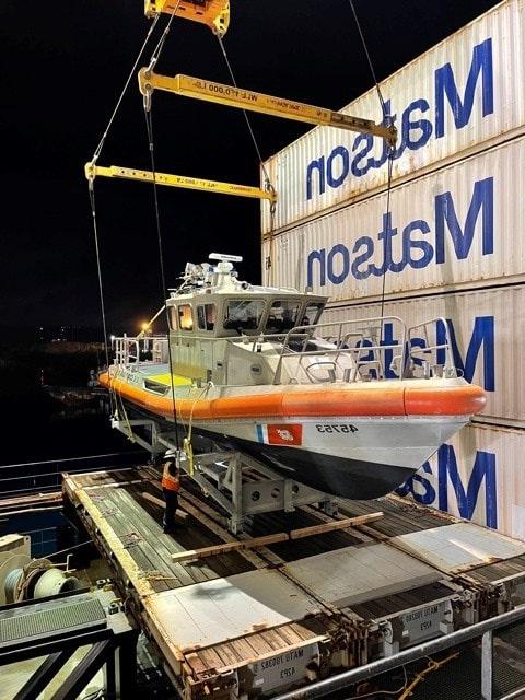 U.S. Coast Guard patrol boat prepares for transport aboard a 澳博体育app下载 vessel as part of 澳博体育app下载's government shipping services.